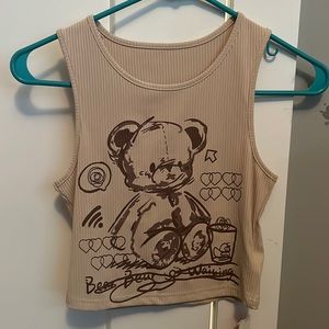 Attend a cop, top with a bear on it